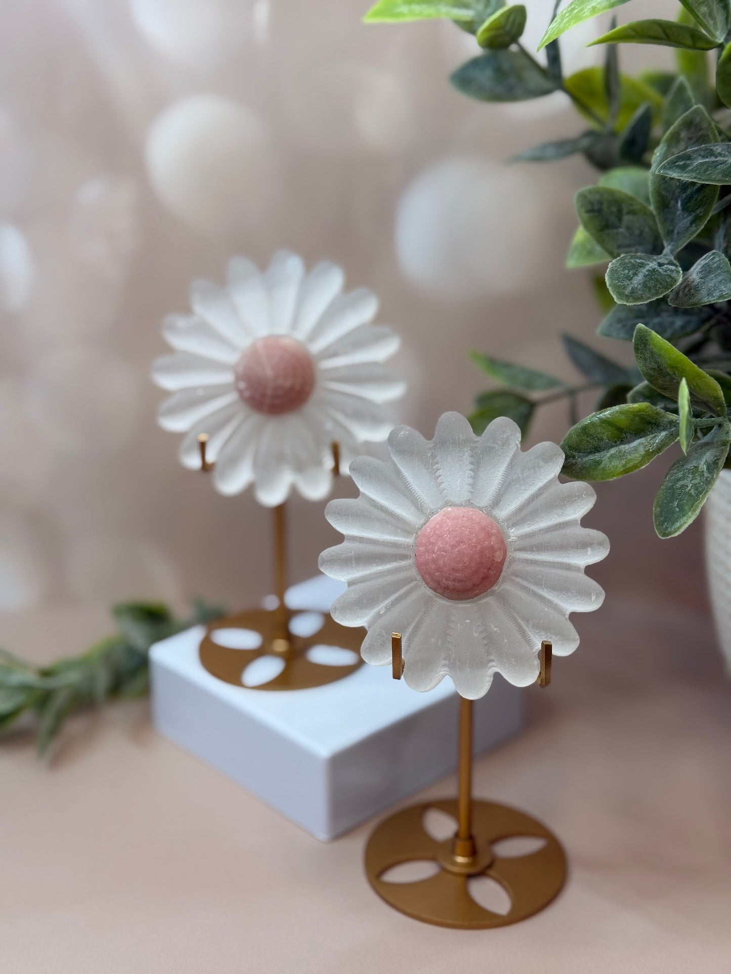selenite flower with pink opal center on stand