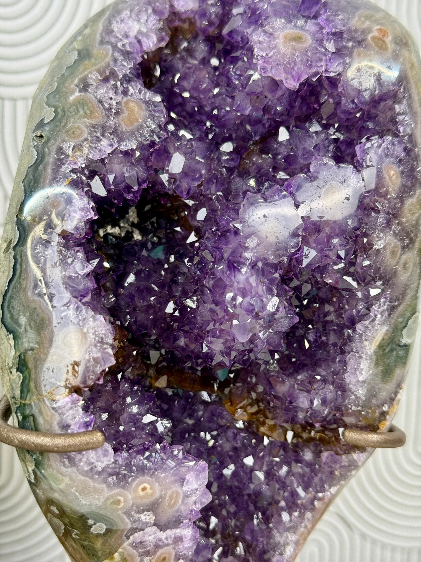 purple orange amethyst with pink stalactite eyes with stand